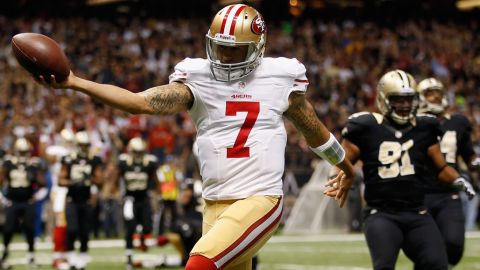 Quarterback Colin Kaepernick of the San Francisco 49ers celebrates after scoring a touchdown against the New Orleans Saints at The Mercedes-Benz Superdome in New Orleans on Sunday.