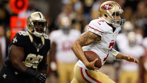Colin Kaepernick of the 49ers runs with the ball against the Saints on Sunday.