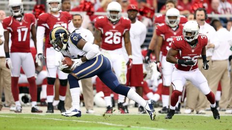 Cornerback Janoris Jenkins of the Rams returns a 36-yard touchdown interception past LaRod Stephens-Howling of the Cardinals during the second quarter on Sunday.