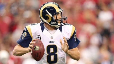 Quarterback Sam Bradford of the Rams drops back to pass against the Cardinals on Sunday.
