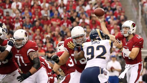 Quarterback Ryan Lindley of the Cardinals throws a pass against the Rams on Sunday.