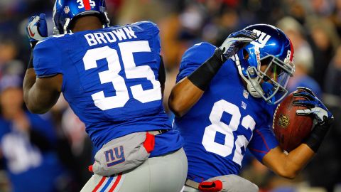 Rueben Randle of the New York Giants, right, celebrates with teammate Andre Brown after scoring a touchdown in the first quarter against the Green Bay Packers.