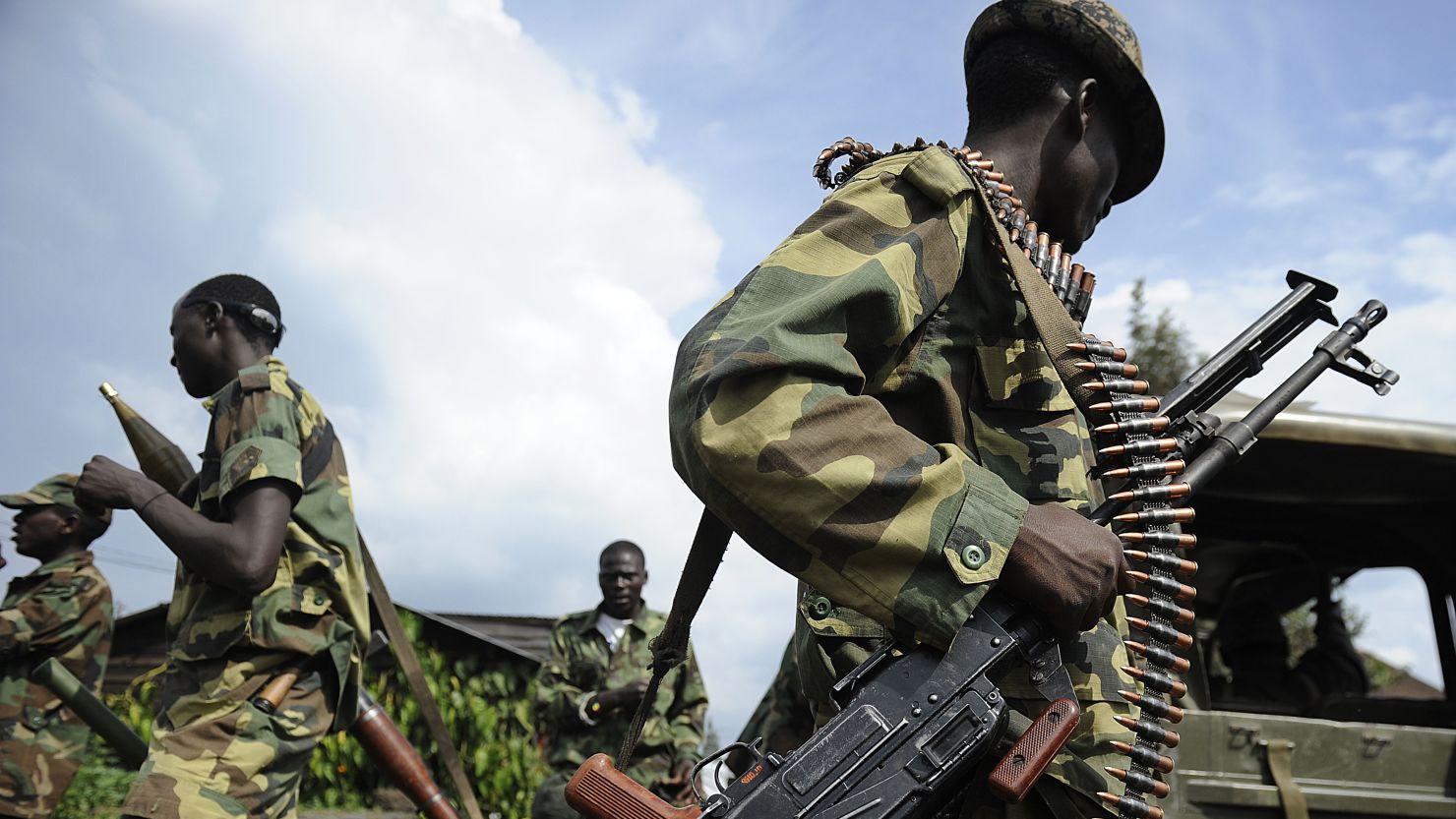 M23 rebel soldiers stand guard at the former Congolese army headquarters in Goma, on Friday, after it was abandoned. 
