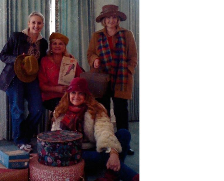 Nita Gilmore, Sherry Downs, Margaret Collins Jenkins and Ouida Muffuletto gather in the late 1990s in an antebellum mansion in Vicksburg, Mississippi, surrounded by hat boxes and items they purchased.  