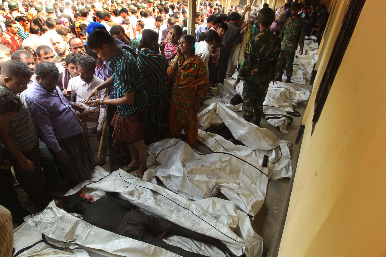 Bodies of victims are lined up in Savar on November 25. Many workers jumped from high windows to escape the smoke and flames.