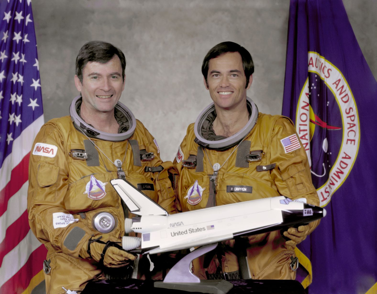 Columbia made the first orbital flight of NASA's space shuttle program on April 12, 1981. Here, crew members John Watts Young, left, and Robert Laurel Crippen hold a model of the orbiter in 1979. 