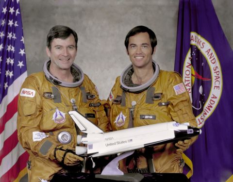 Columbia made the first orbital flight of NASA's space shuttle program on April 12, 1981. Here, crew members John Watts Young, left, and Robert Laurel Crippen hold a model of the orbiter in 1979. 