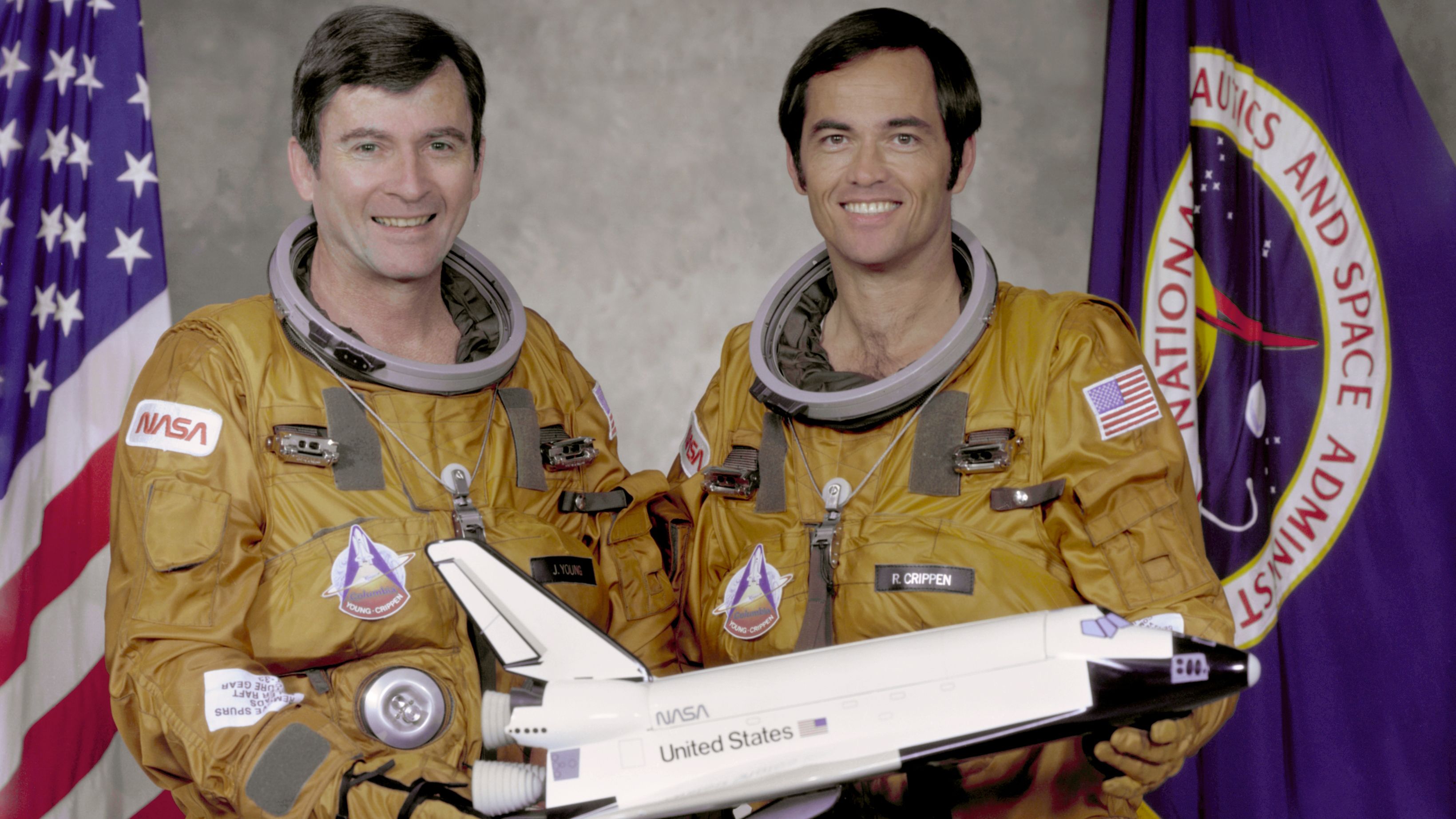 Columbia made the first orbital flight of NASA's space shuttle program on April 12, 1981. Here, crew members John Watts Young, left, and Robert Laurel Crippen hold a model of the orbiter in 1979. 