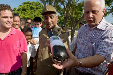 Gen. Arnaldo Tamayo Mendez, center, looks at a homemade rocket in Havana, Cuba, in 2009. Mendez became the first Latin American, the first person of African descent and the first Cuban to fly in space when he flew aboard the Soviet Soyuz 38 on September 18, 1980.