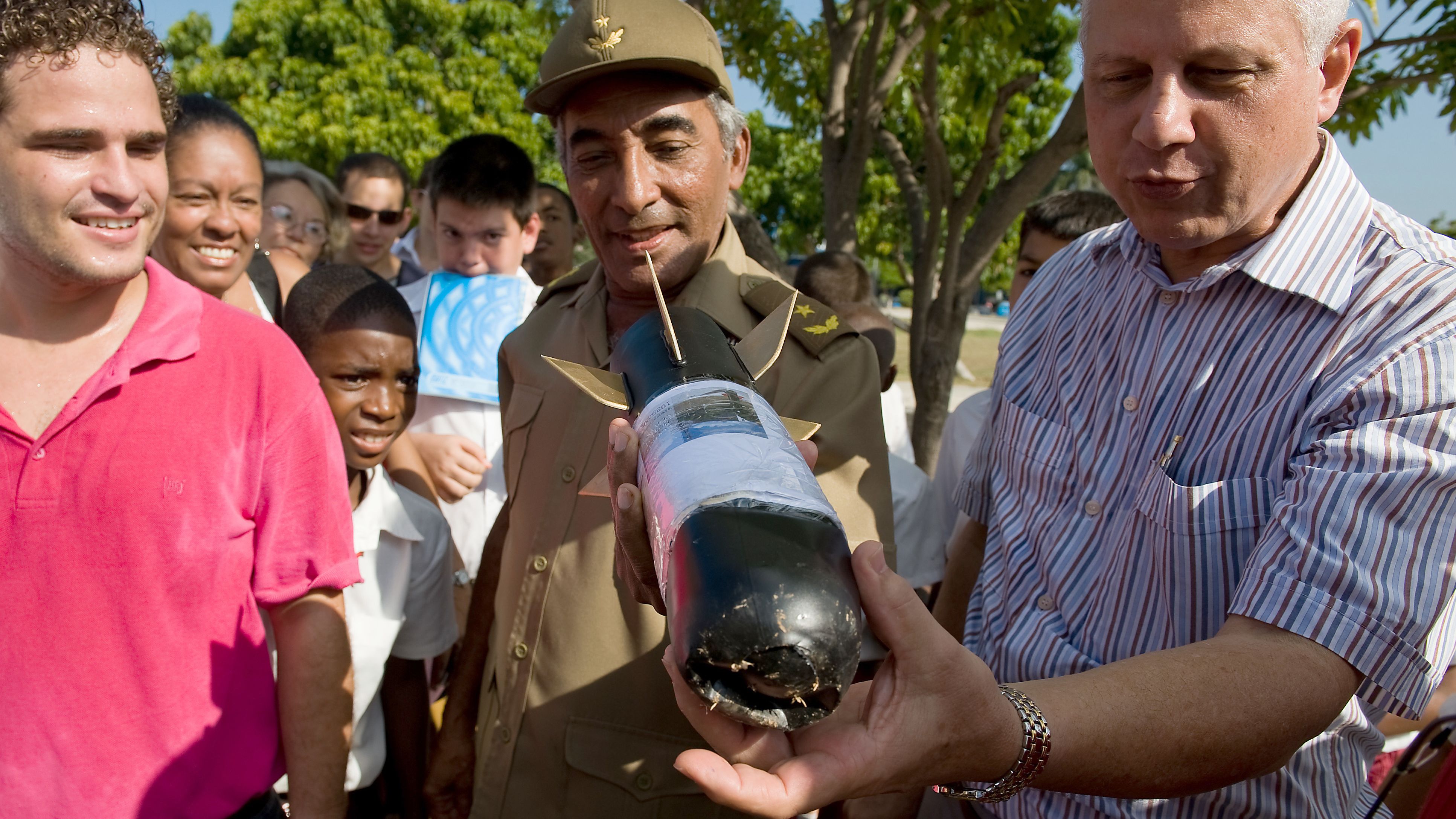 Gen. Arnaldo Tamayo Mendez, center, looks at a homemade rocket in Havana, Cuba, in 2009. Mendez became the first Latin American, the first person of African descent and the first Cuban to fly in space when he flew aboard the Soviet Soyuz 38 on September 18, 1980.