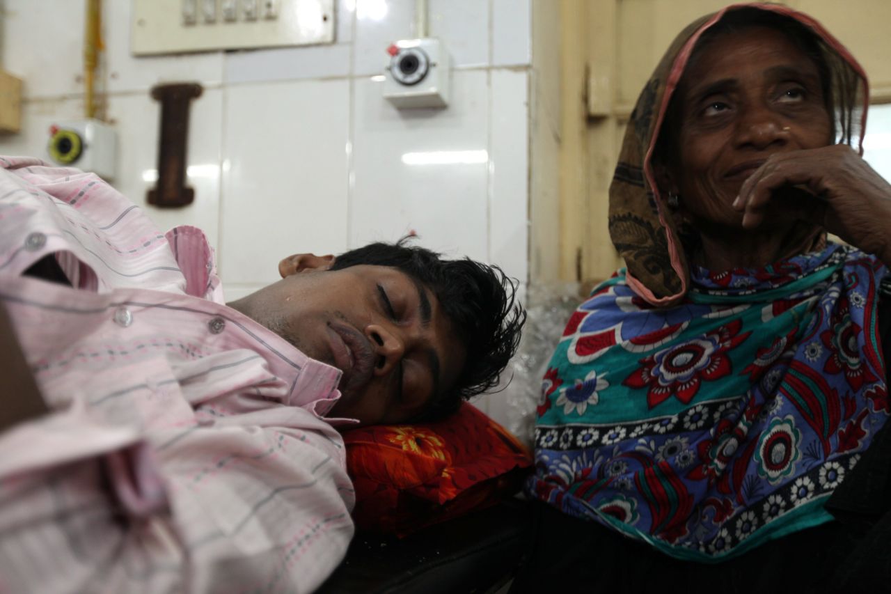 Masud Rana, one of the survivors, receives treatment at Dhaka Medical Hospital on November 26. The factory was owned by Tazreen Fashions, which manufactured clothing for C&A, Carrefour and Wal-Mart, reports said. Wages at the factory are about $43 a week for a garment worker.