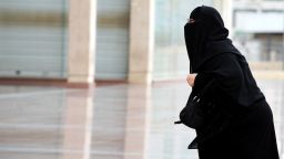 A fully-veiled Saudi woman walks into the Olaya mall in Riyadh on November 19, 2012. Women in Saudi Arabia, who are veiled in public and banned from driving, face further restrictions with a new law allowing airport security to report their movements to their male 'guardians', a move that is deemed by rights activists a form of 'slavery' as any Saudi woman intending to travel must carry a 'yellow slip' as a proof of consent granted to her. AFP PHOTO/FAYEZ NURELDINE (Photo credit should read FAYEZ NURELDINE/AFP/Getty Images) 