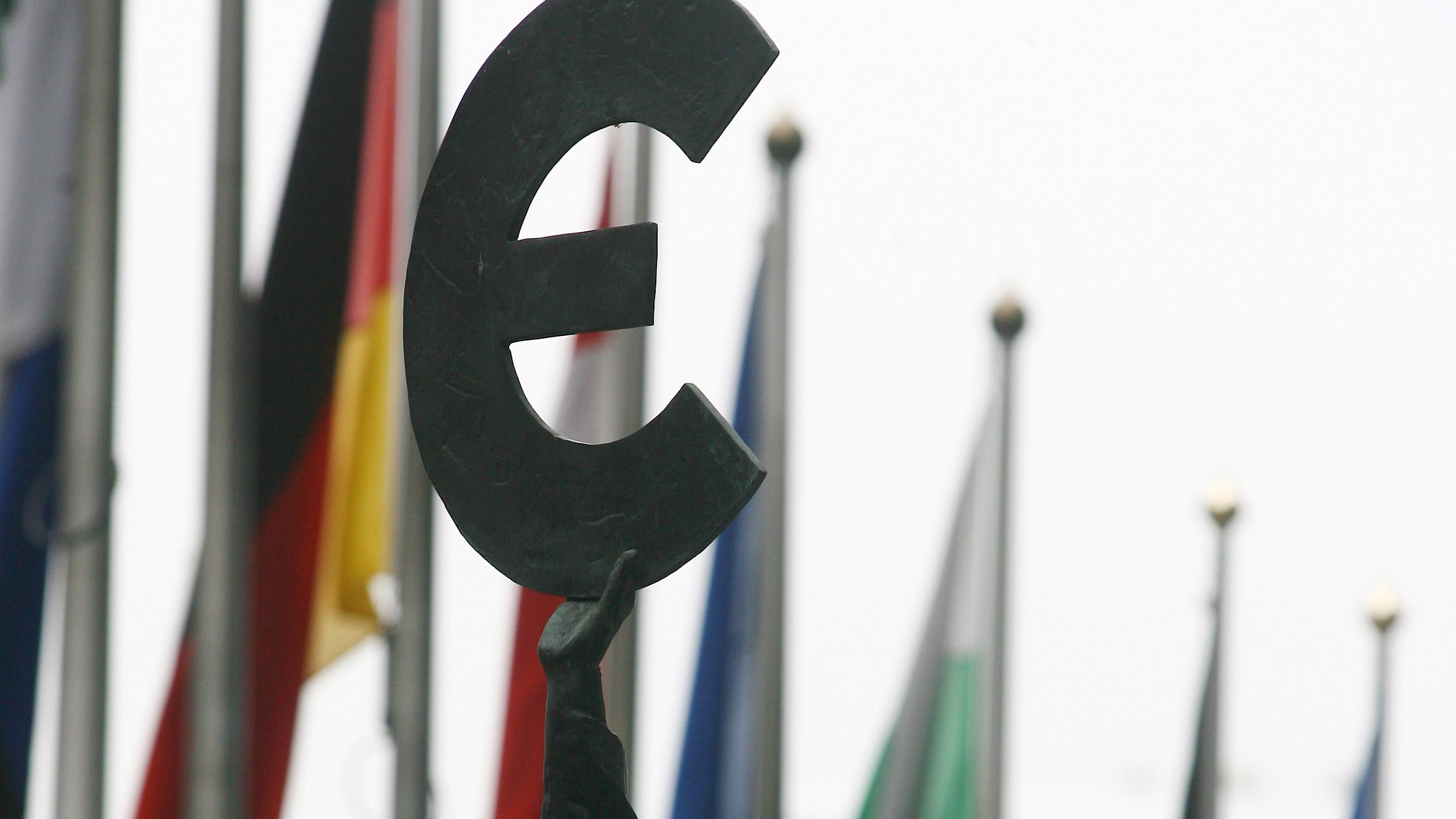 A file image of a statue brandishing a Euro symbol outside the EU parliament in Brussels.