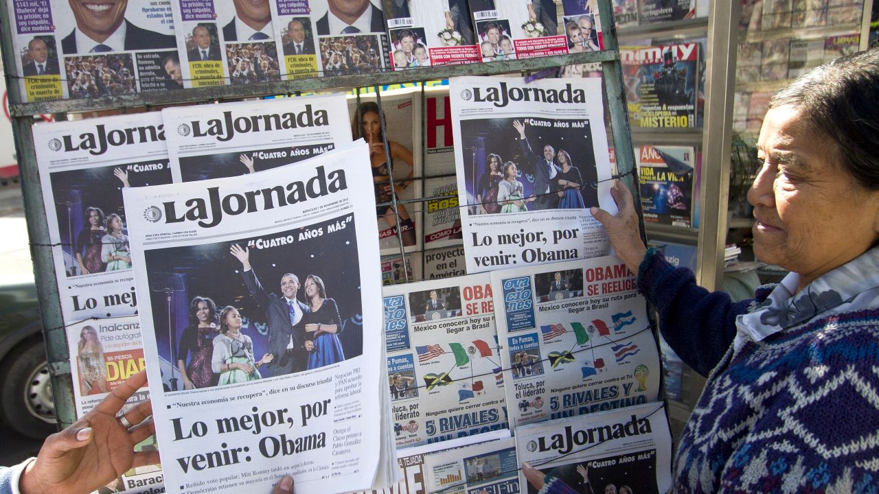 Newspaper headlines at a newstand in Mexico City report U.S. President Obama has won re-election. 