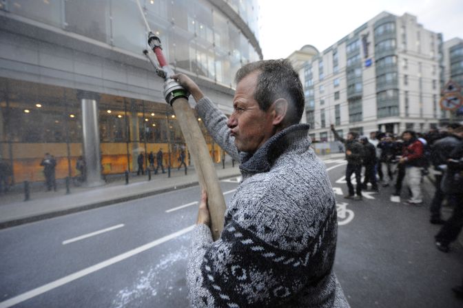 A demonstrator shoots milk in the air during Monday's protest.