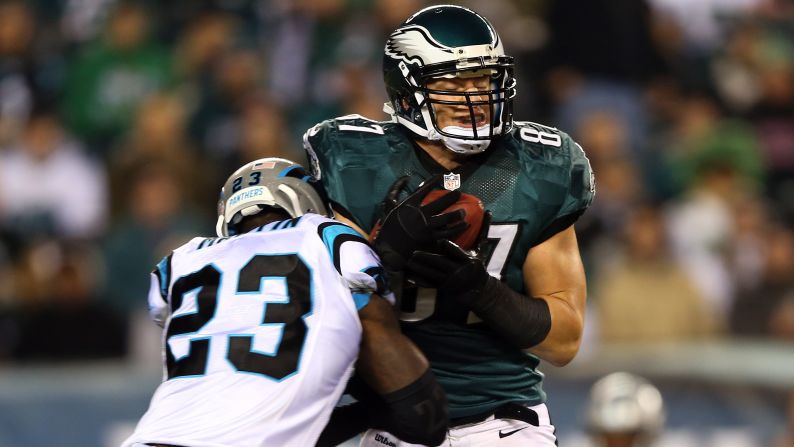 Brent Celek of the Philadelphia Eagles catches a pass as Sherrod Martin of the Carolina Panthers makes the tackle.