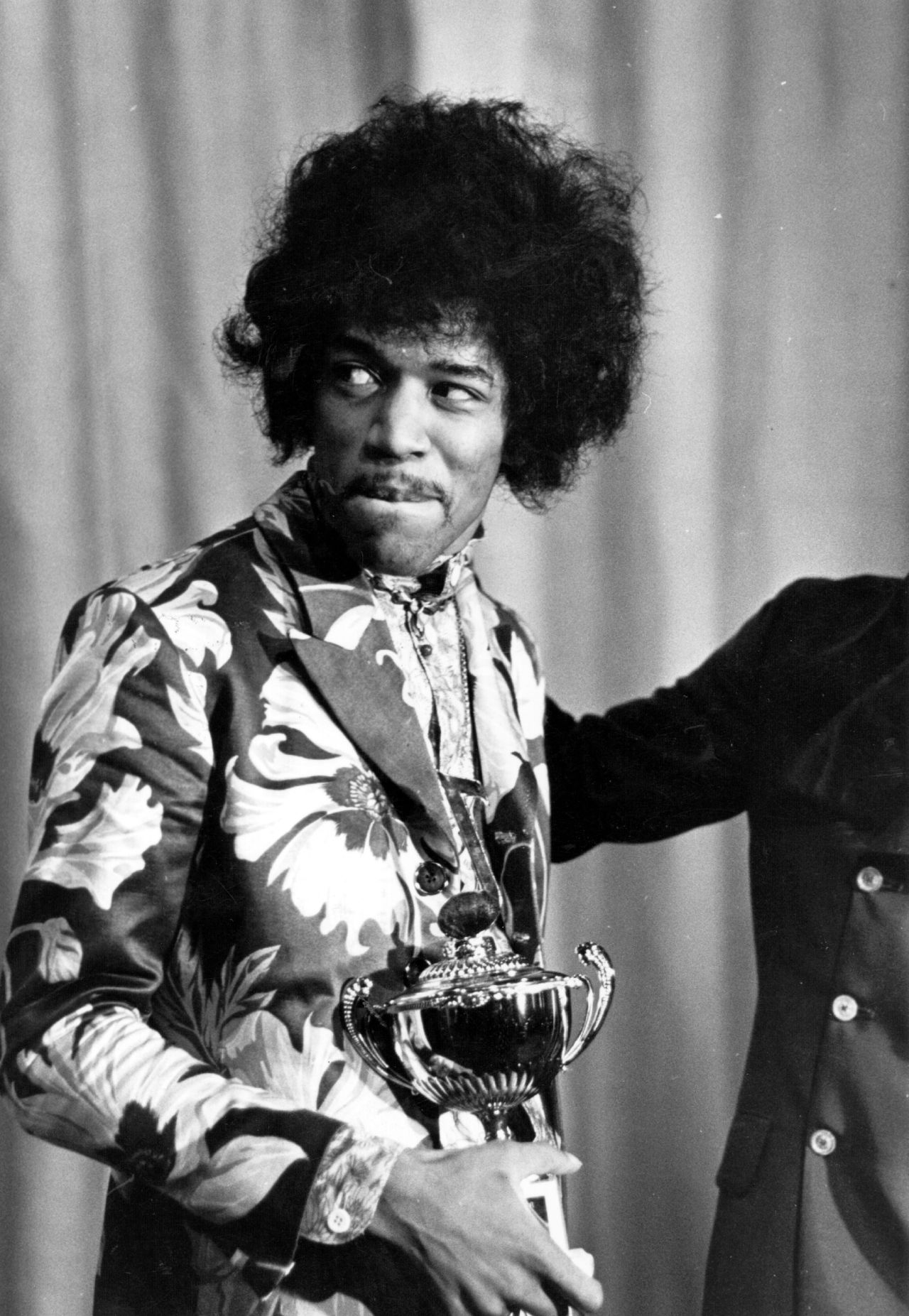 Seen here in October 1967, Hendrix receives an award from Radio One DJ Jimmy Savile. The Experience's first single, "Hey Joe," was released that year and was a phenomenal hit in the U.K. Another smash, "Purple Haze," and the group's double-platinum first album "Are You Experienced?" soon followed.