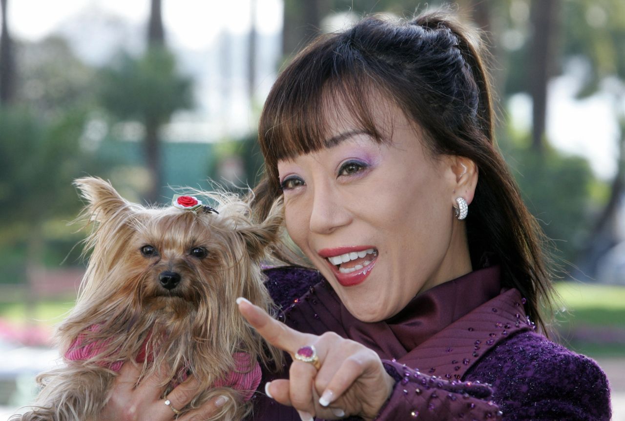 Sumi Jo has three dogs and travels with one of them whenever she can. Here she poses with one during the 41st MIDEM, the world's biggest music trade fair, in Cannes in 2007. 