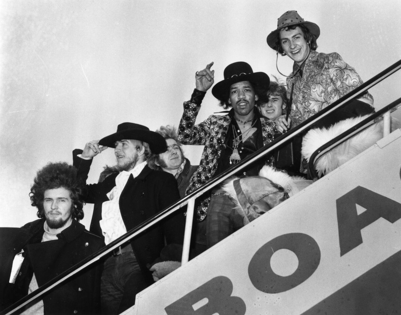 Here, Jimi Hendrix and drummer Mitch Mitchell board a plane in London in 1968, along with various members of the Byrds, the Soft Machine and the Alan Price Set. The Experience disbanded in 1969, but that same year Hendrix gave a memorable performance at Woodstock.