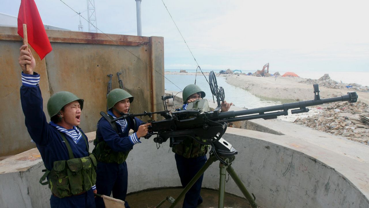 Vietnamese sailors training with a 12.7 mm machine gun on Phan Vinh Island in the disputed Spratly archipelago in 2011.