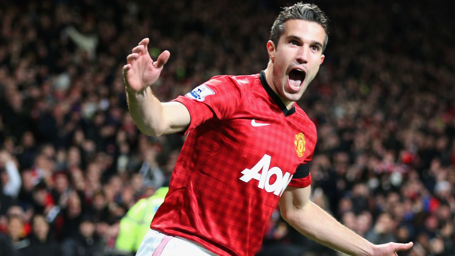 Robin van Persie celebrates his quickfire goal after just 33 seconds for Manchester United against West Ham.