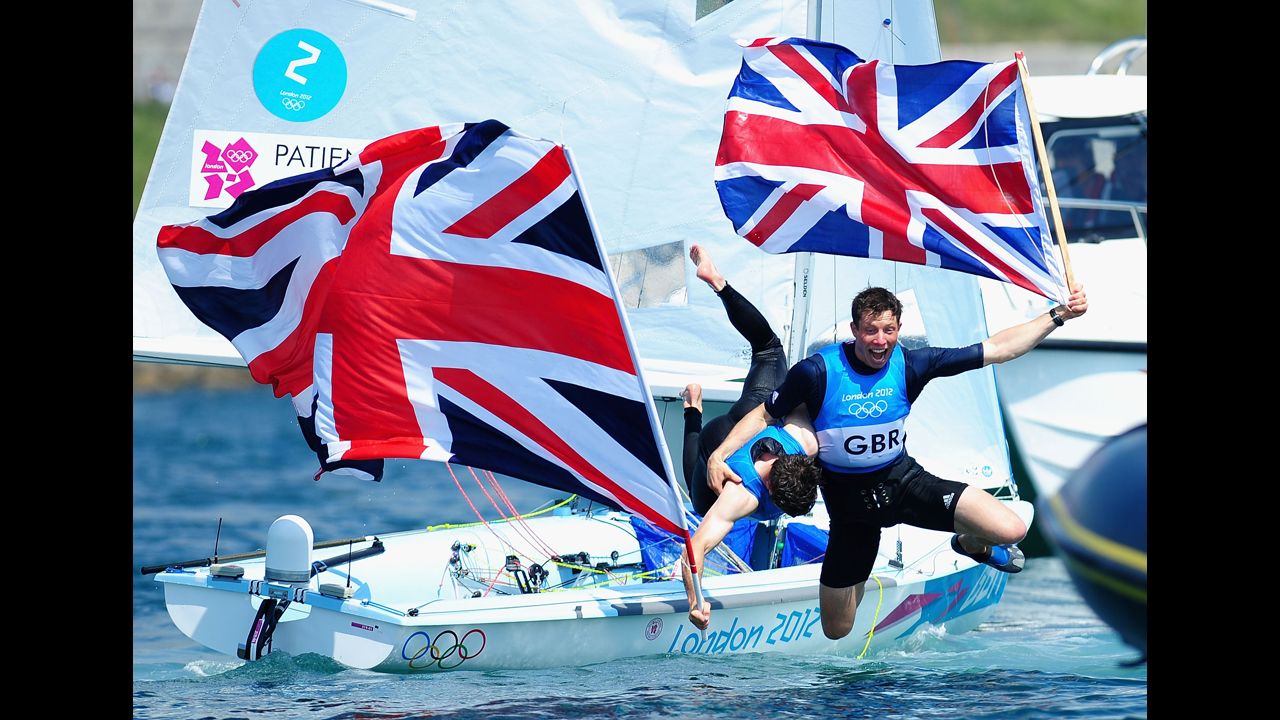 Luke Patience, left, and Stuart Bithell of Great Britain celebrate after finishing second and winning the silver medal in the men's 470 Sailing on Day 14 of the London 2012 Olympic Games on August 10 in Weymouth, England.