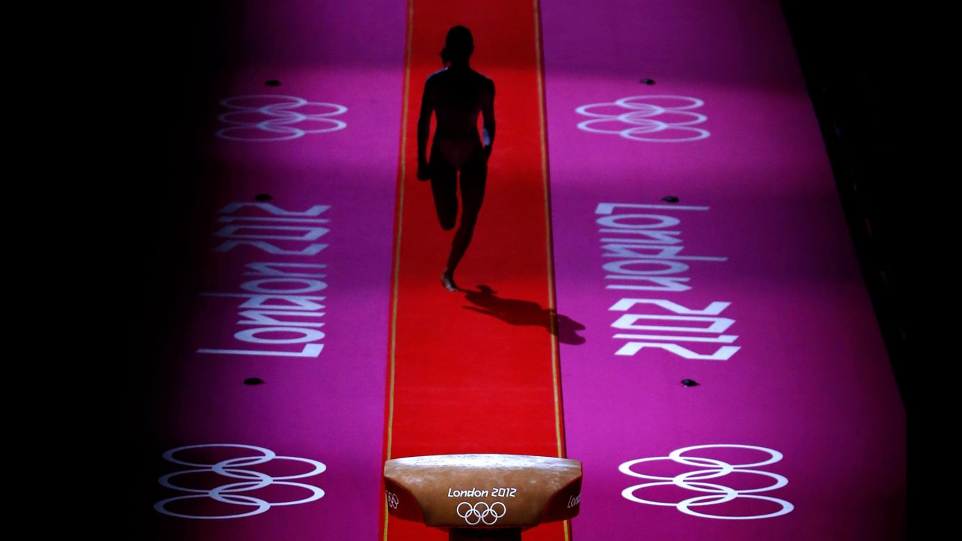 A gymnast performs during warmups before the start of the artistic gymnastics women's team final on Day 4 of the London 2012 Olympic Games on July 31 in London.