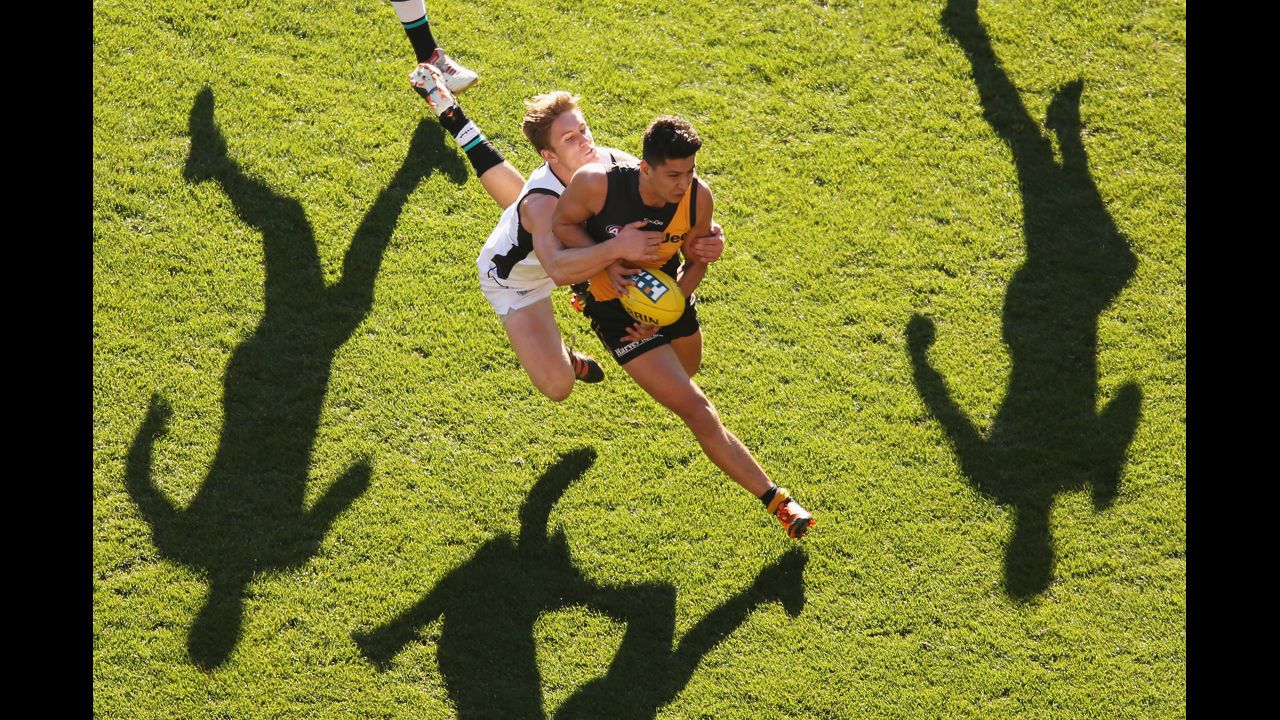 Robin Nahas of the Richmond Tigers is tackled during an AFL match against the Port Adelaide Power at the Melbourne Cricket Ground on September 2 in Melbourne, Australia.