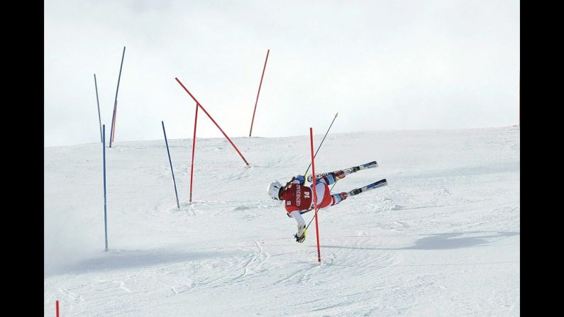 Switzerland's Fabienne Suter falls during the super combined slalom of the women's Alpine Skiing World Cup event on January 27 in St. Moritz, Switzerland.