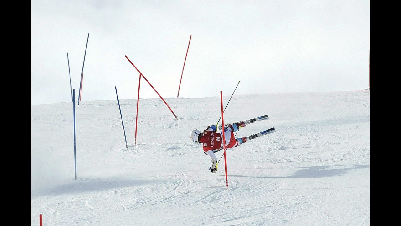Switzerland's Fabienne Suter falls during the super combined slalom of the women's Alpine Skiing World Cup event on January 27 in St. Moritz, Switzerland.