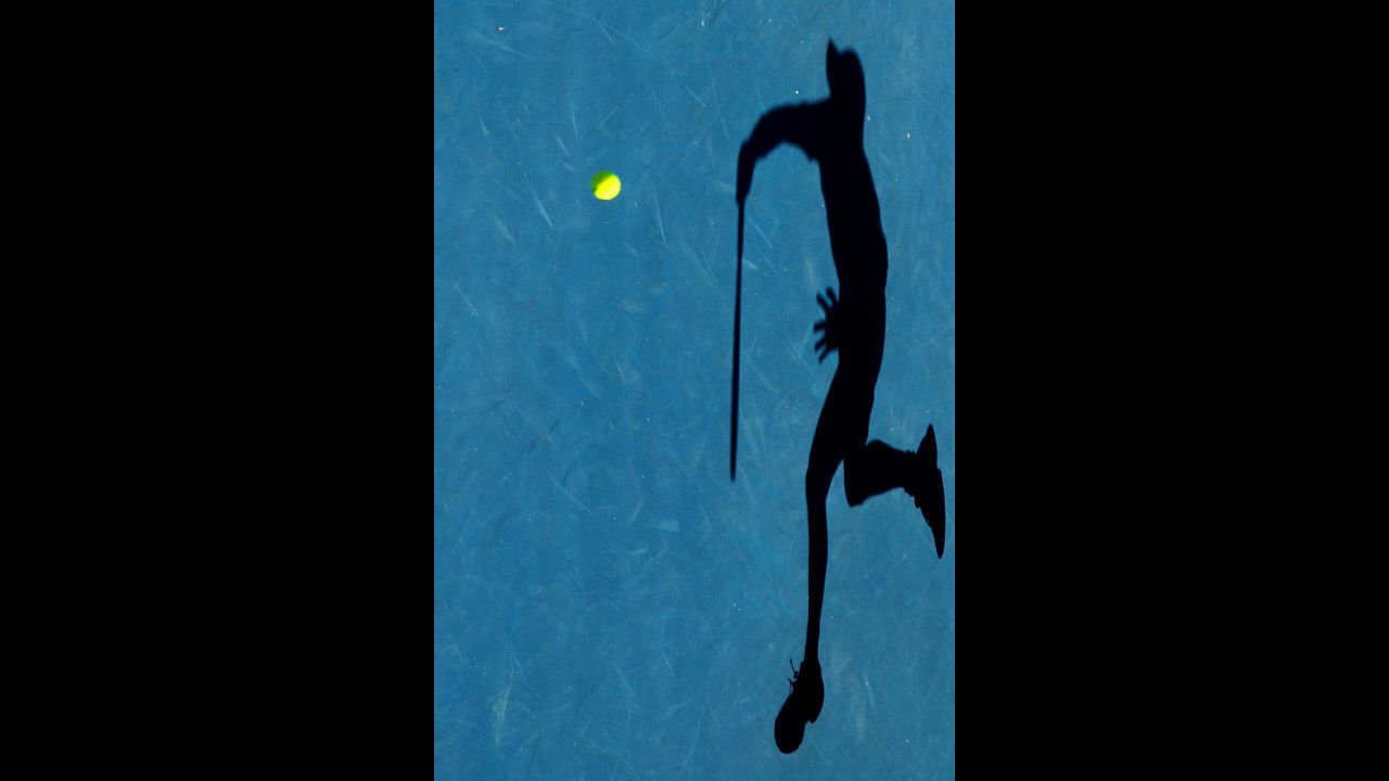 Kei Nishikori of Japan serves during his quarterfinal match against Andy Murray of Great Britain on Day 10 of the 2012 Australian Open on January 25 in Melbourne, Australia.