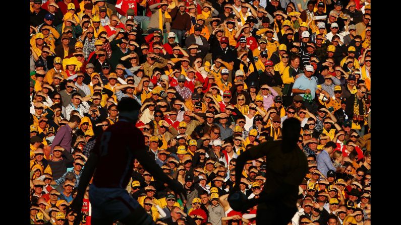 Fans watch from the stands as Kurtley Beale of the Australian Wallabies looks to pass during the International Rugby Test match against Wales on June 23 in Sydney, Australia. 