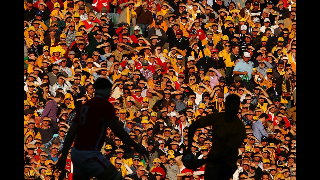Fans watch from the stands as Kurtley Beale of the Australian Wallabies looks to pass during the International Rugby Test match against Wales on June 23 in Sydney, Australia. 