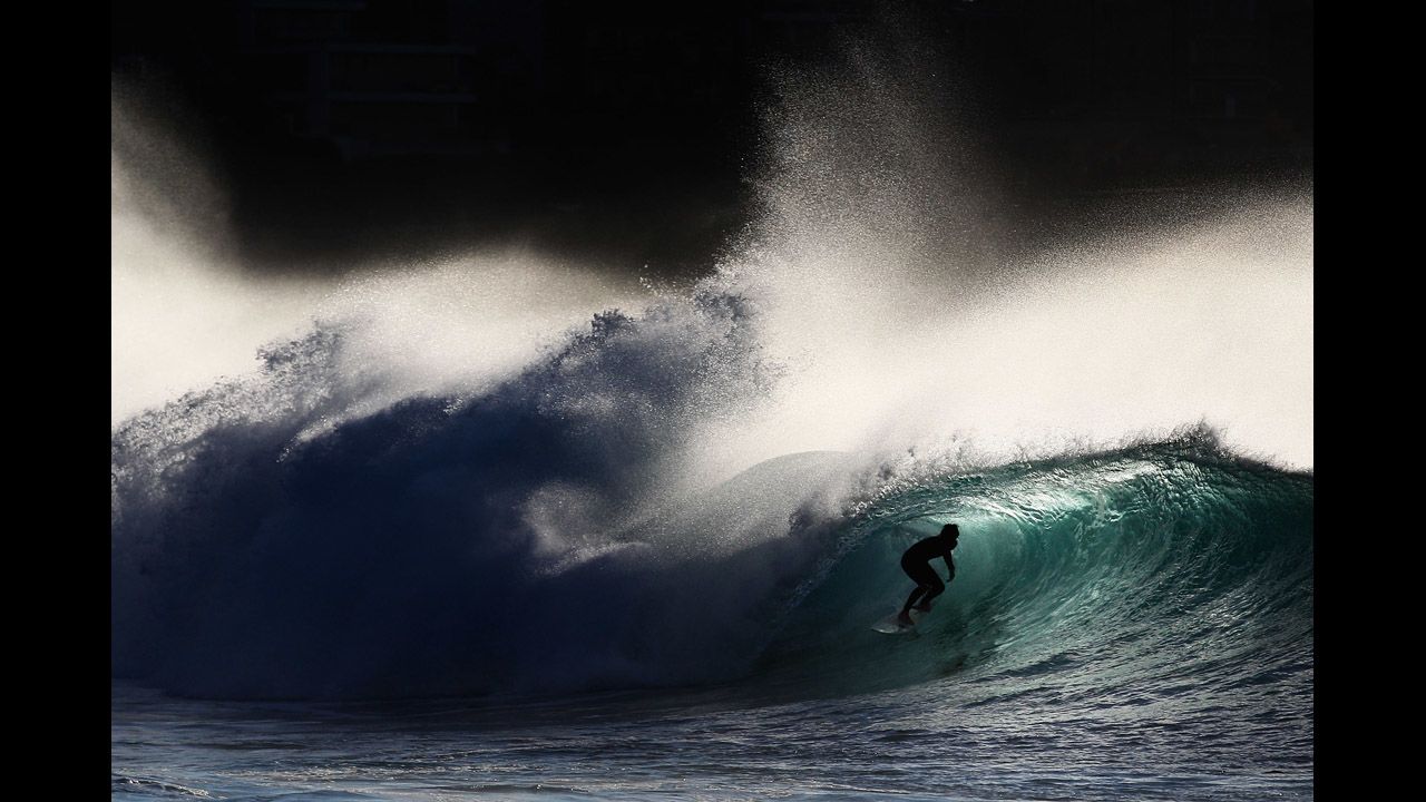 A surfer rides a wave at Bronte Beach on May 8 in Sydney, Australia.  