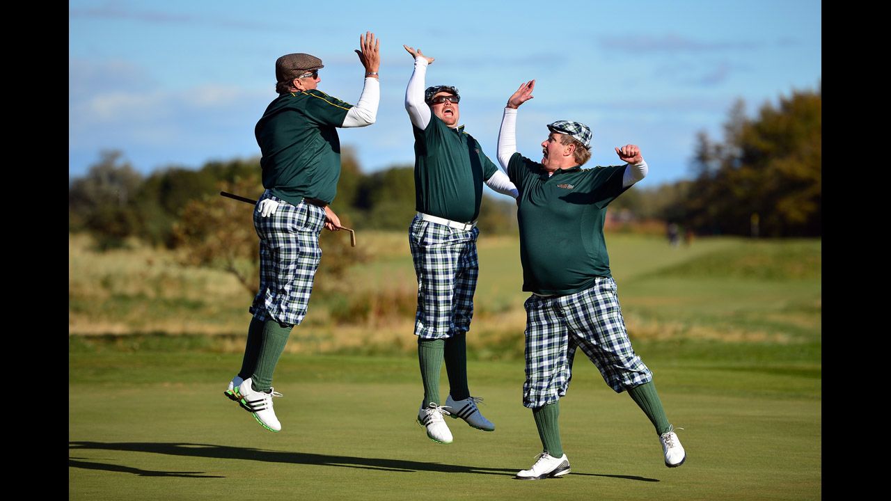 Golfers dressed in outfits from the 1930s play on Monifeith Links course during the 8th World Hickory Open on October 8 in Monifeith, Scotland.