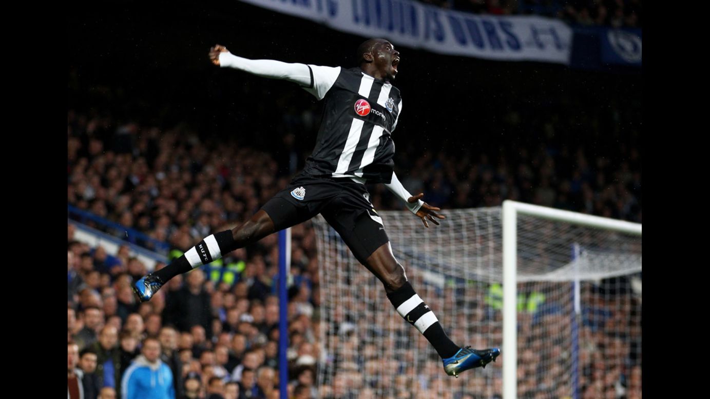 Papiss Cisse of Newcastle United celebrates after scoring the opening goal during the Barclays Premier League match against Chelsea at Stamford Bridge on May 2 in London.