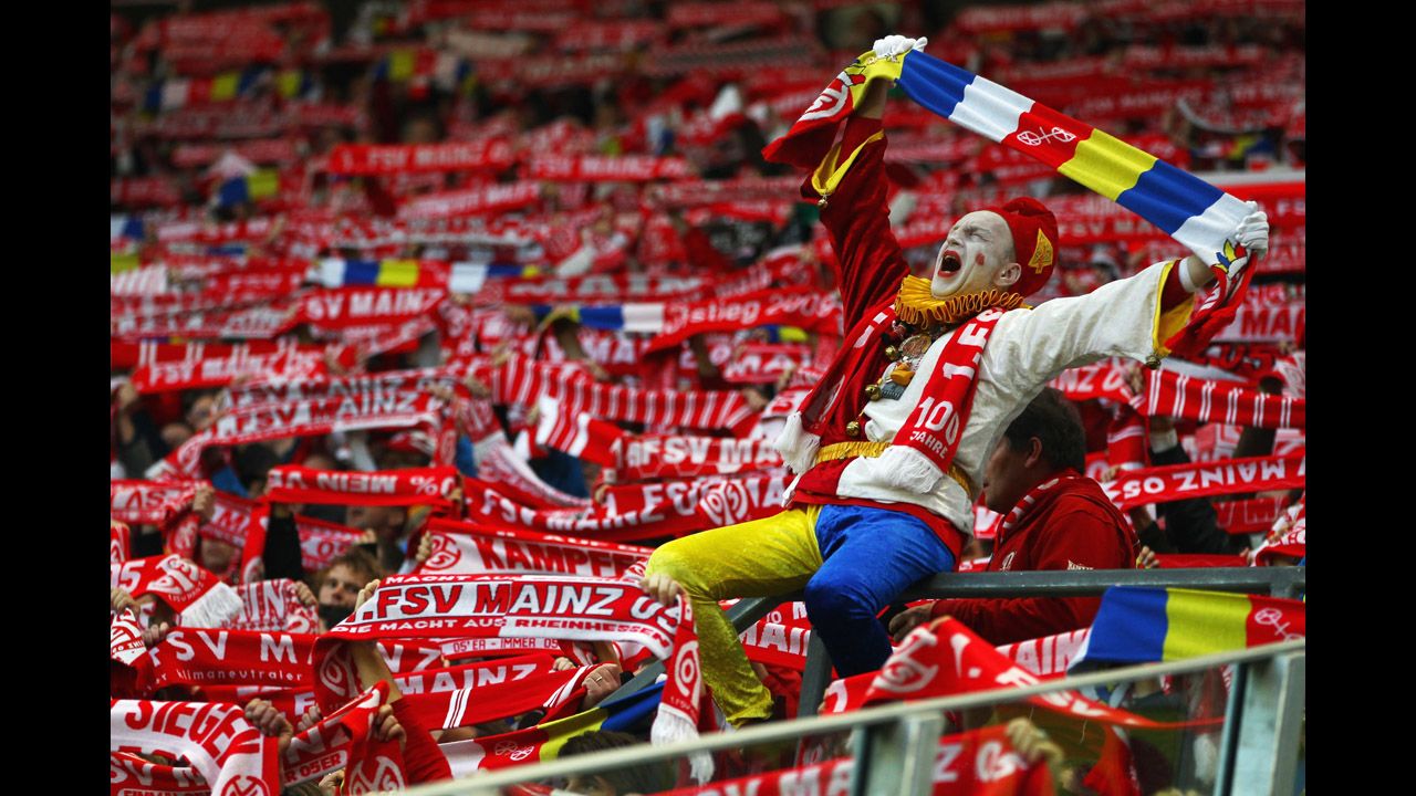 Supporters of the local team cheer prior to the Bundesliga match between FSV Mainz 05 and VfL Wolfsburg at Coface Arena on April 20 in Mainz, Germany. 