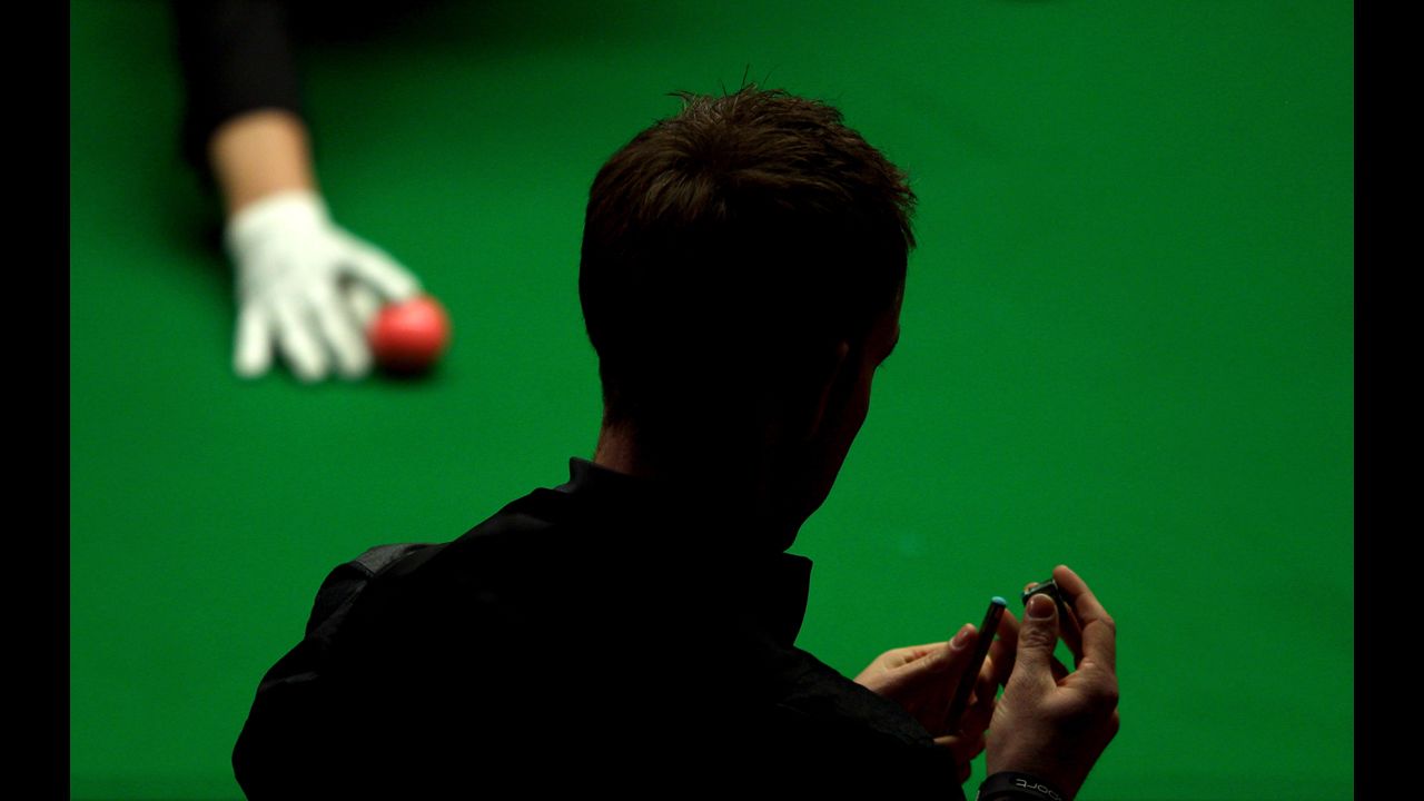 Allister Carter of England competes against Ronnie O'Sullivan of England during the final of the Betfred.com World Snooker Championship on May 6 at the Crucible Theatre in Sheffield, England. 
