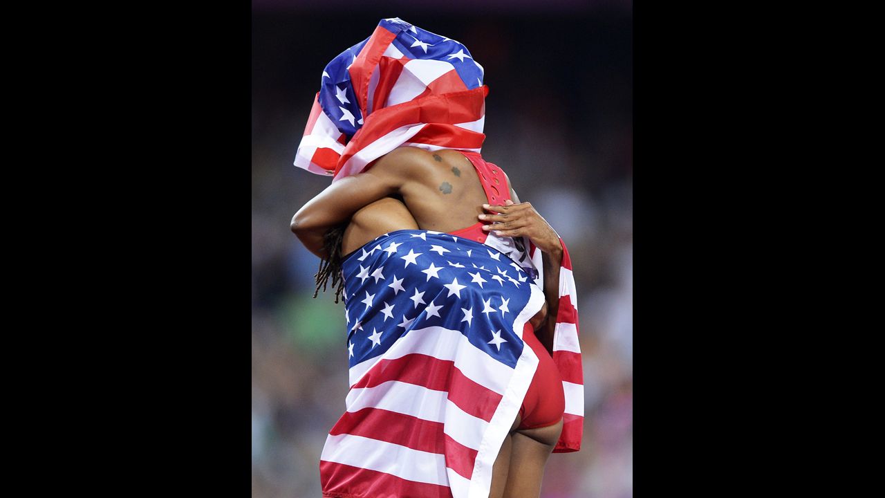Jason Richardson, left, and Carmelita Jeter celebrate after placing third in the women's 200-meter and men's 110-meter finals at the London 2012 Olympics on August 8.