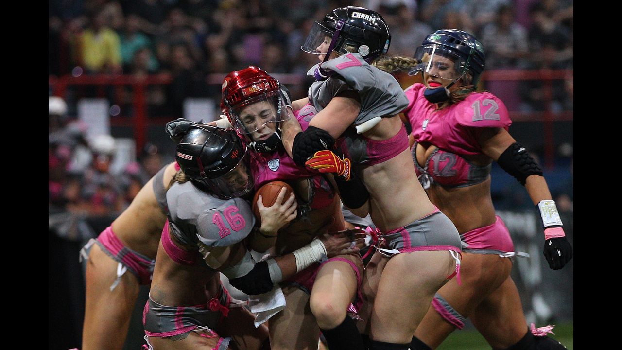 Nikki Johnson of the Western Conference is tackled during first game of the Lingerie Football League All-Star Tour on June 2 in Brisbane, Australia.