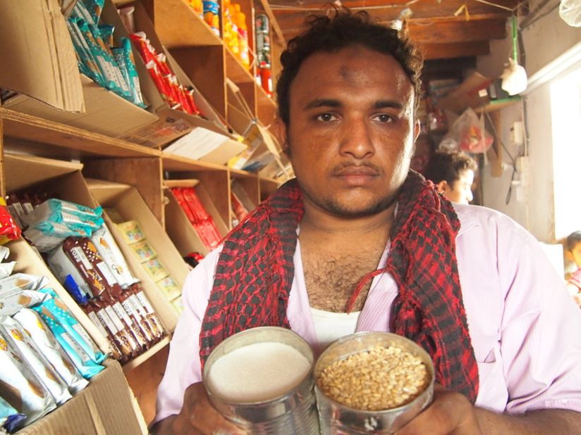 Yemeni shopkeeper Ala'a Abdullah Farag Wans: I worry one day that I'll go out of business because my customers can't pay me back.