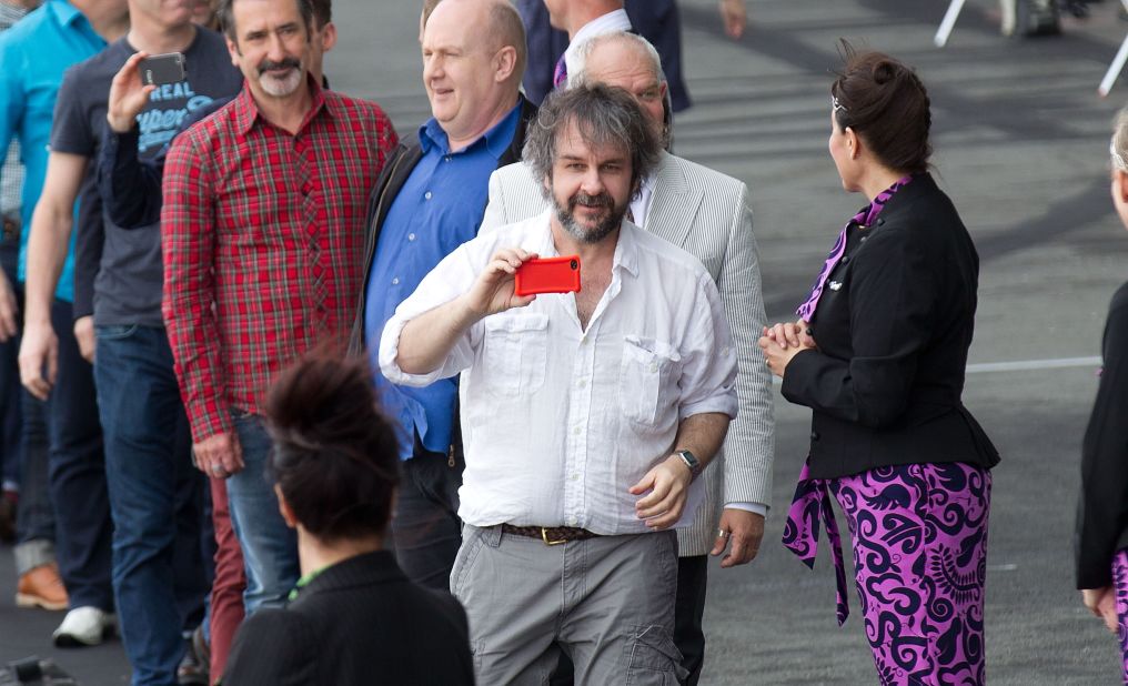 "Hobbit" director Peter Jackson (c), pictured here at Wellington airport, has filmed a number of blockbusters in his native New Zealand.