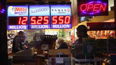People buy tickets on November 28 for the record Powerball jackpot, which swelled to $587.6 million.