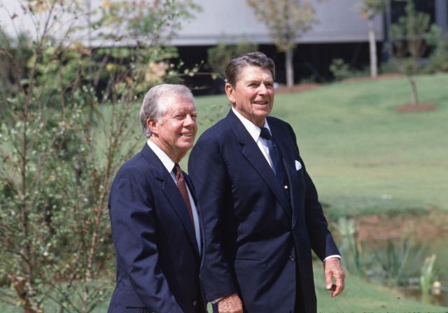 President Ronald Reagan attends the dedication ceremony for Jimmy Carter's presidential library in Atlanta in October 1986, nearly six years after Reagan had defeated him in his bid for a second term.