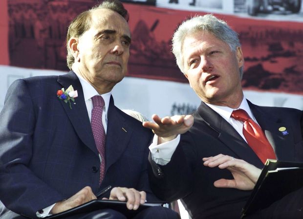 President Bill Clinton talks with former Sen. Bob Dole, his presidential rival four years earlier, before making remarks at the WWII Memorial groundbreaking ceremony in Washington on October 11, 2000.