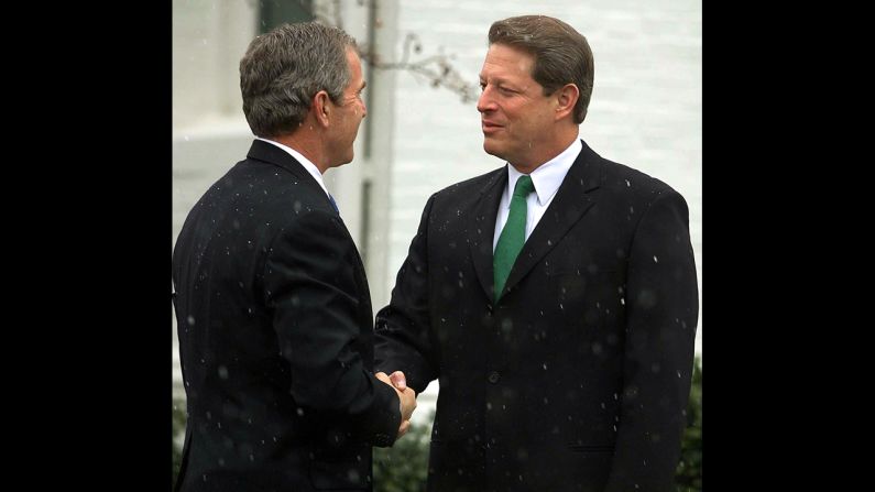 President-elect George W. Bush appears with his former Democratic rival then-Vice President Al Gore in Washington on December 19, 2000, after Bush had met with President Bill Clinton earlier in the day. The meeting with Gore was the first since Gore conceded the disputed election to Bush a week earlier and more than a month after Election Day.