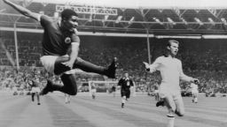 Benfica inside-left Eusebio da Silva Ferreira takes a flying kick to score the first goal of the match 18 minutes into the European Cup final against AC Milan at Wembley, 22nd May 1963. Milan won the match 2-1 