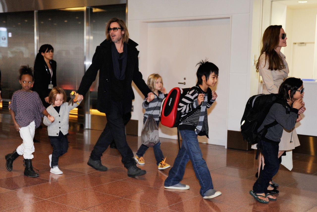 Every so often, photographers will catch the entire Jolie-Pitt clan all at once, which is what happened here as the family arrives at the Haneda Airport in Tokyo in November 2011. They were in town to promote Pitt's film "Moneyball," which earned him another Oscar nomination, his third for acting.