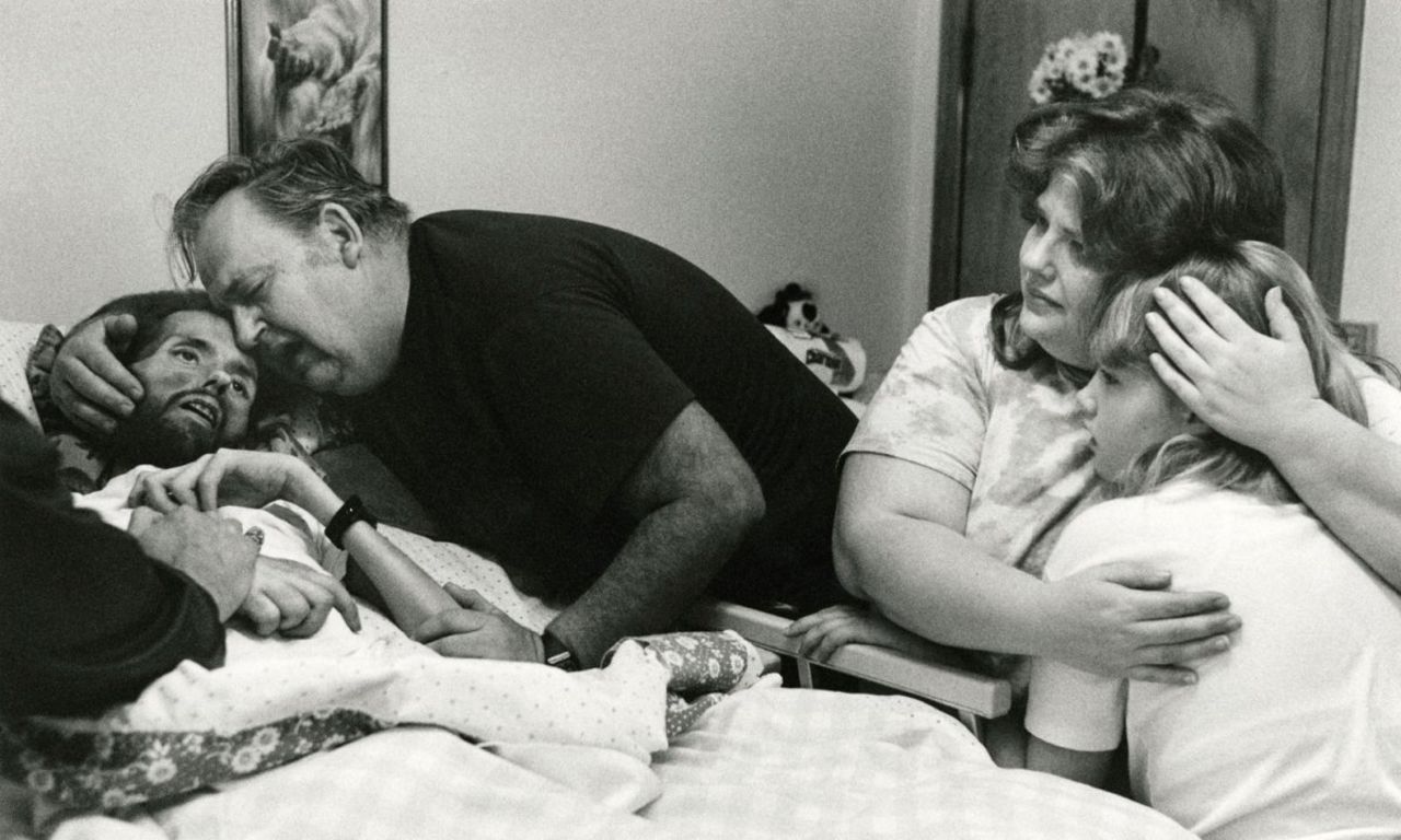 The above image was published in LIFE Magazine in November 1990 showing AIDS patient David Kirby taking his last breaths surrounded by his family in Ohio. The image, shot by Therese Frare, became the face of the HIV/AIDS epidemic. See the entire collection of images on <a href="http://life.time.com/history/behind-the-picture-the-photo-that-changed-the-face-of-aids/?iid=lb-gal-viewagn#1" target="_blank" target="_blank">Life.com</a>.