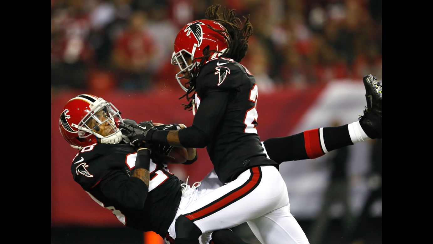 Thomas DeCoud of the Atlanta Falcons intercepts a pass in the end zone of the New Orleans Saints on Thursday.